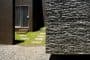 exterior-casa-bioclimatica-CaPaco-detalle fachada con piedra basáltica