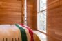 Cabaña-Alpina-madera-dormitorio