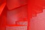 detalle chapa perforada en escalera metalica roja